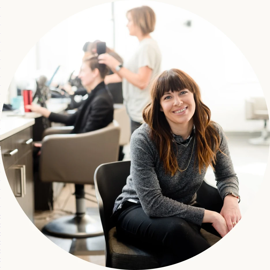 Smiling salon client in a bright studio